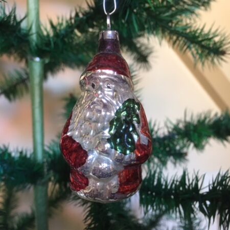 Oude kleine kerstman met rood pak midden 1900
