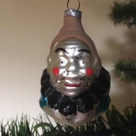 Oude antieke kerstbal een clownshoofd uit het midden van 1900