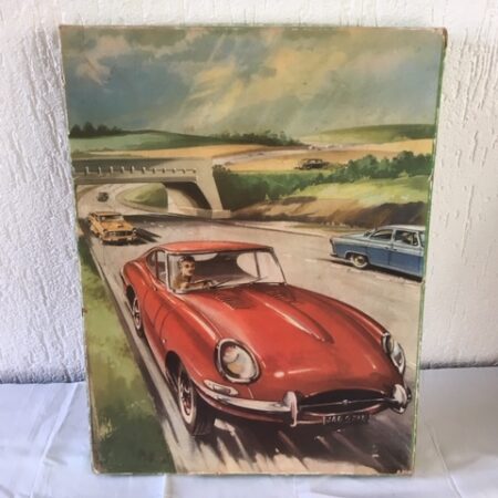 Retro houten puzzel van een rode Jaguar E-type uit de sixty's