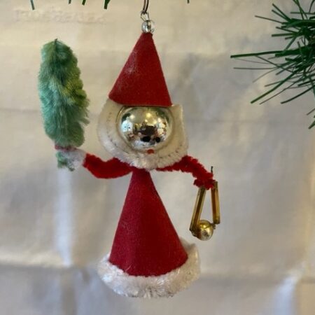 Uit Gablonz een kerstman met kerstboom en muziek instrument 1950