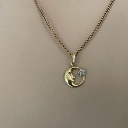 14 kt. geelgouden hanger met halve maan en ster met diamant