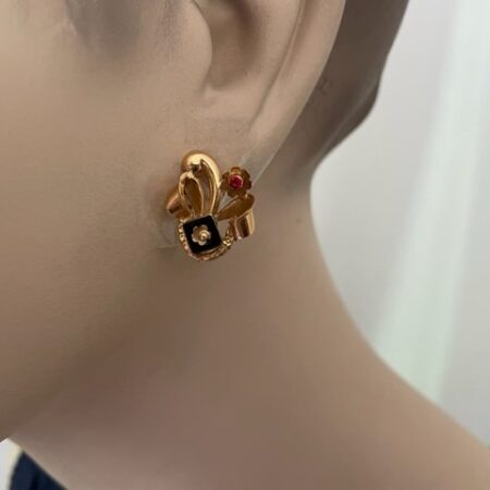 Paar 18 kt. geelgouden retro oorhangers met onyx en zirkonia
