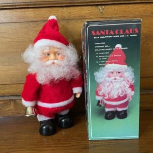 Oude Kerstman speeldoos op  batterijen die loopt en klingelt met zijn bel in de originele doos