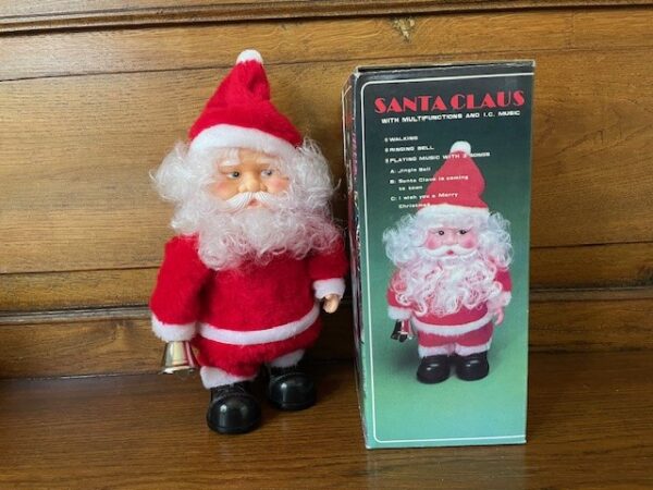 Oude Kerstman speeldoos op  batterijen die loopt en klingelt met zijn bel in de originele doos